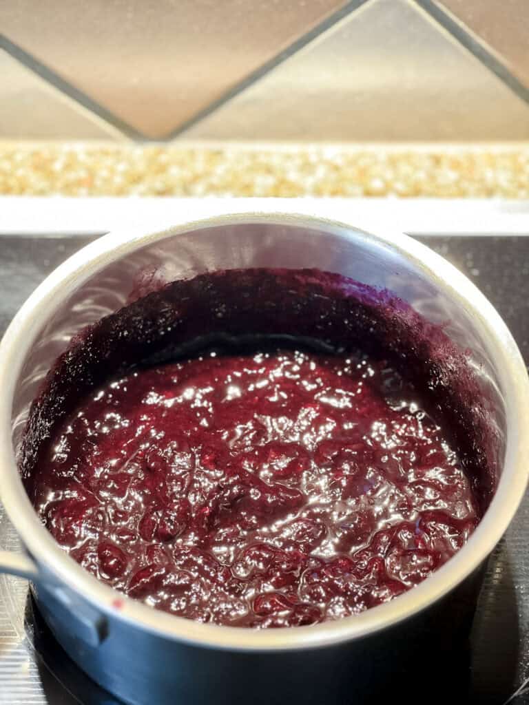 Blueberry butter after cooking and it thickens.