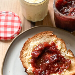 A slice of brioche toast is slathered with clotted cream and Freezer Friendly Refrigerator Homemade Fig Jam Recipe.