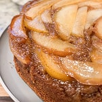 A front side view of a delicious caramelized upside down pear cake post bake.