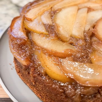A front side view of a delicious caramelized upside down pear cake post bake.