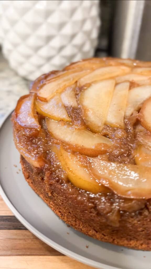 A front side view of a delicious caramelized upside down pear cake post bake.