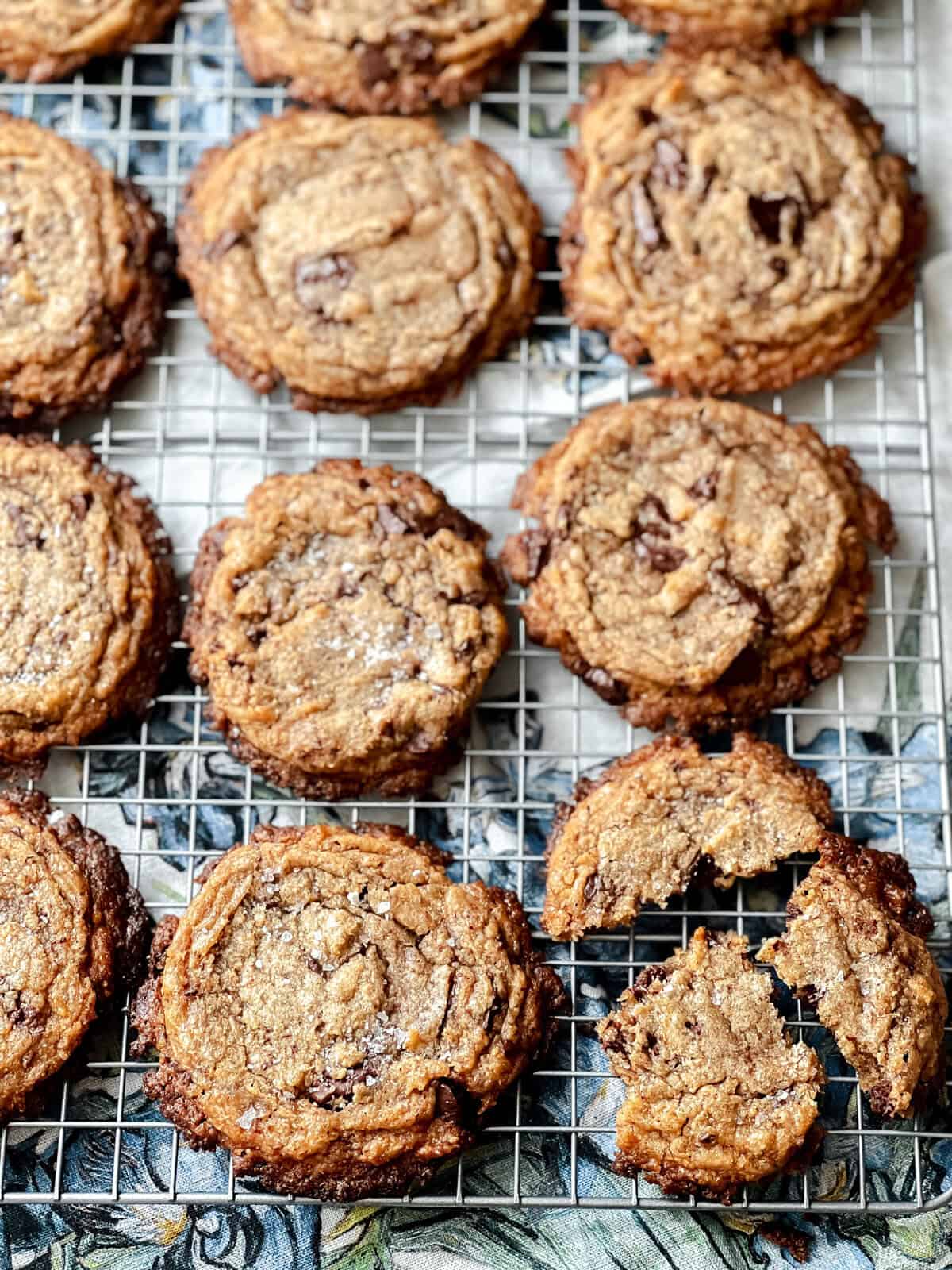 Chocolate chip cookies with bananas on a wire cooling rack.