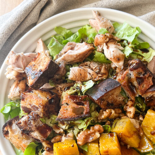 Overhead photo of Roasted Golden Beets with Balsamic and Walnuts in a simple salad.