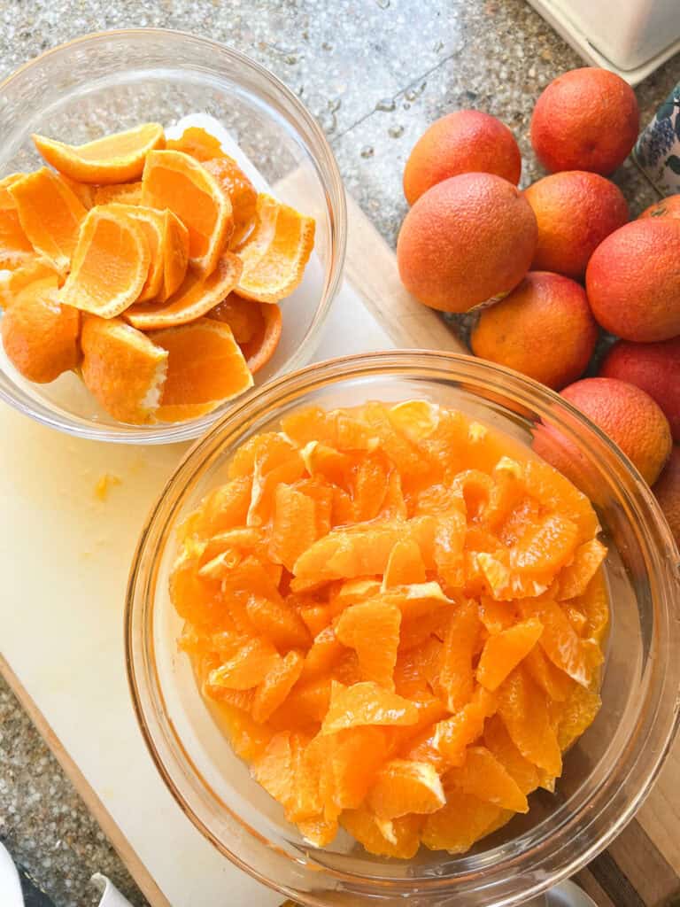 Flatlay photo of diced mandarins and the peeled skins in preparation for the Mandarin Marmalade Recipe.