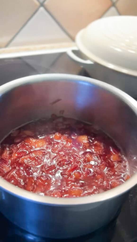 Overhead photo of the Santa Rosa Plum Compote at the end of its cooktime. The amber flesh is now a deep purple hue after simmering for 20 minutes. 