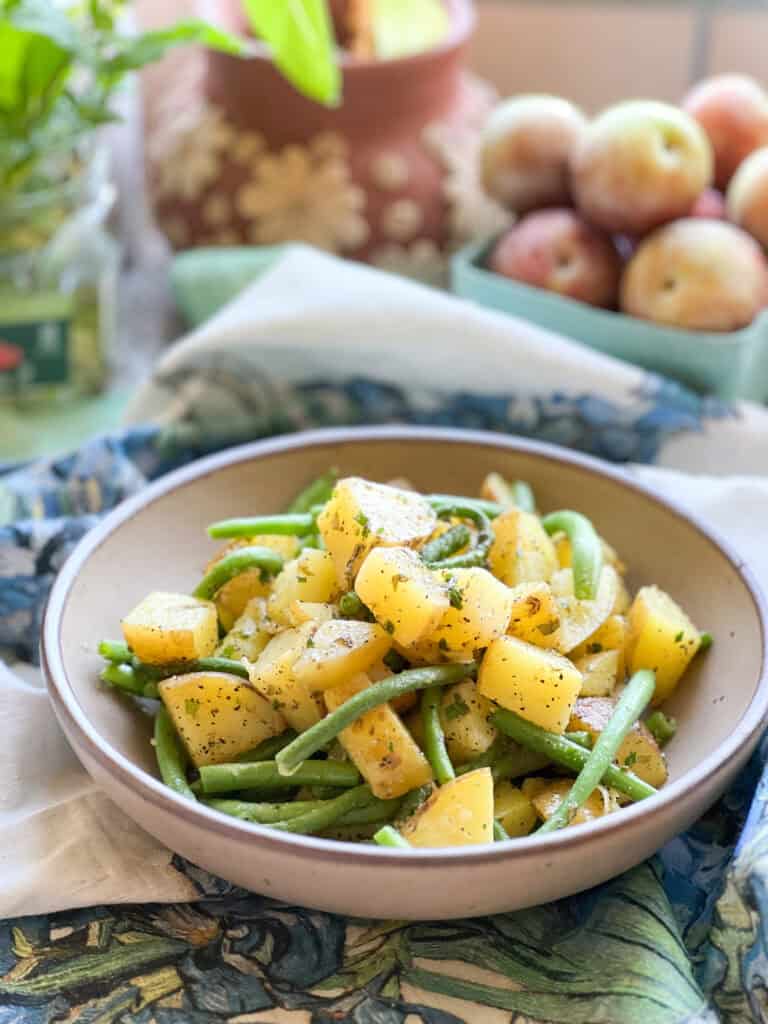 Portrait photo of the finished dish of Sauteed New Potatoes & Green Beans with Sorrel Butter