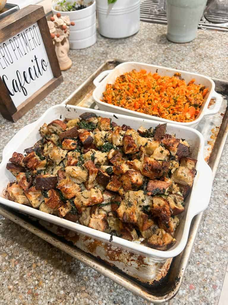 Finished Sourdough Stuffing with Mushroom and Herb Recipe sitting alongside Carrots on Parade.