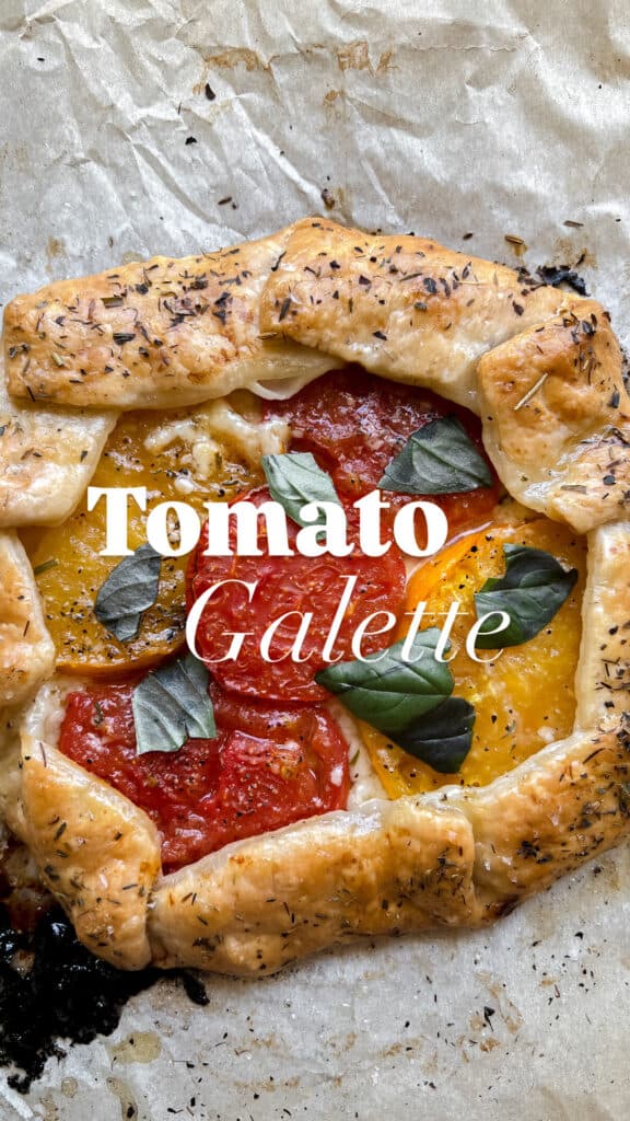 Cover photo of a freshly baked Heirloom Tomato Galette with text overlay that says "Tomato Galette"