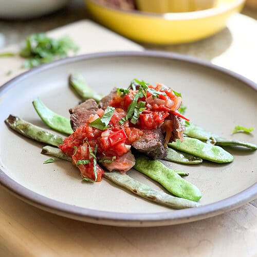Portrait photo of plated Sauteed Romano Beans in Quick Tomato Sauce.