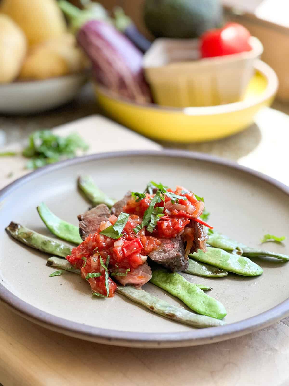 Portrait photo of plated Sauteed Romano Beans in Quick Tomato Sauce.