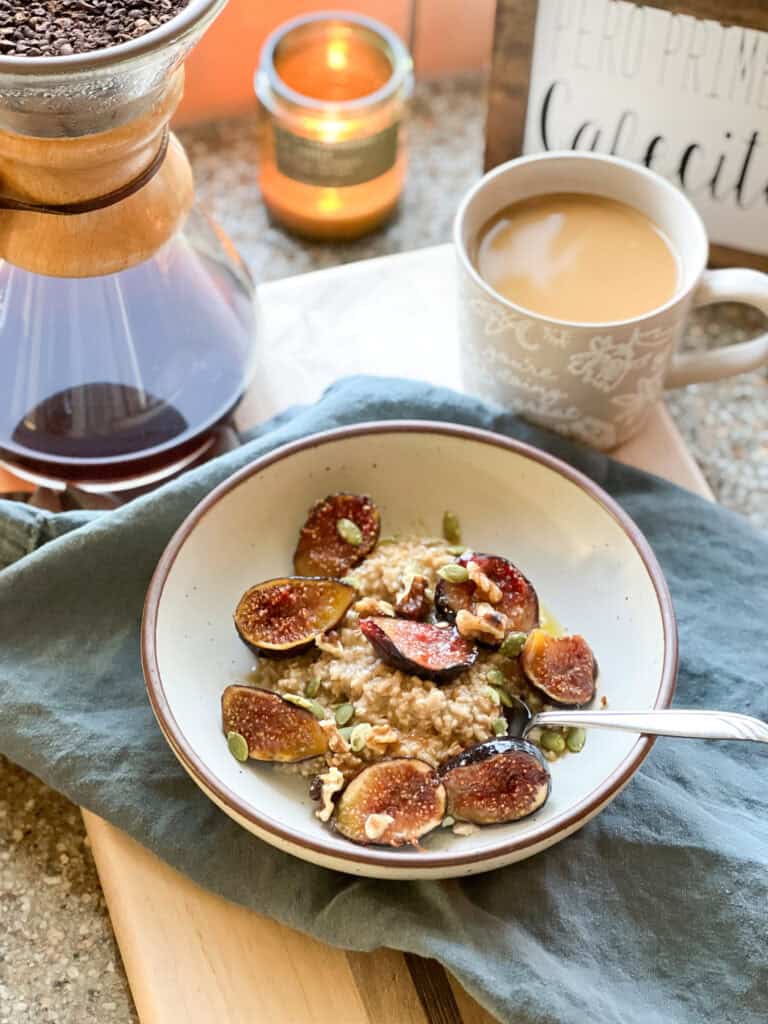 Portrait photo of the caramelized figs atop a warm bowl of oatmeal.