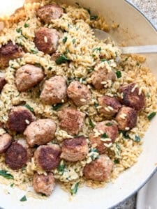 overhead image of the finished One Pan Orzo with Pesto and Herby Chicken Meatballs